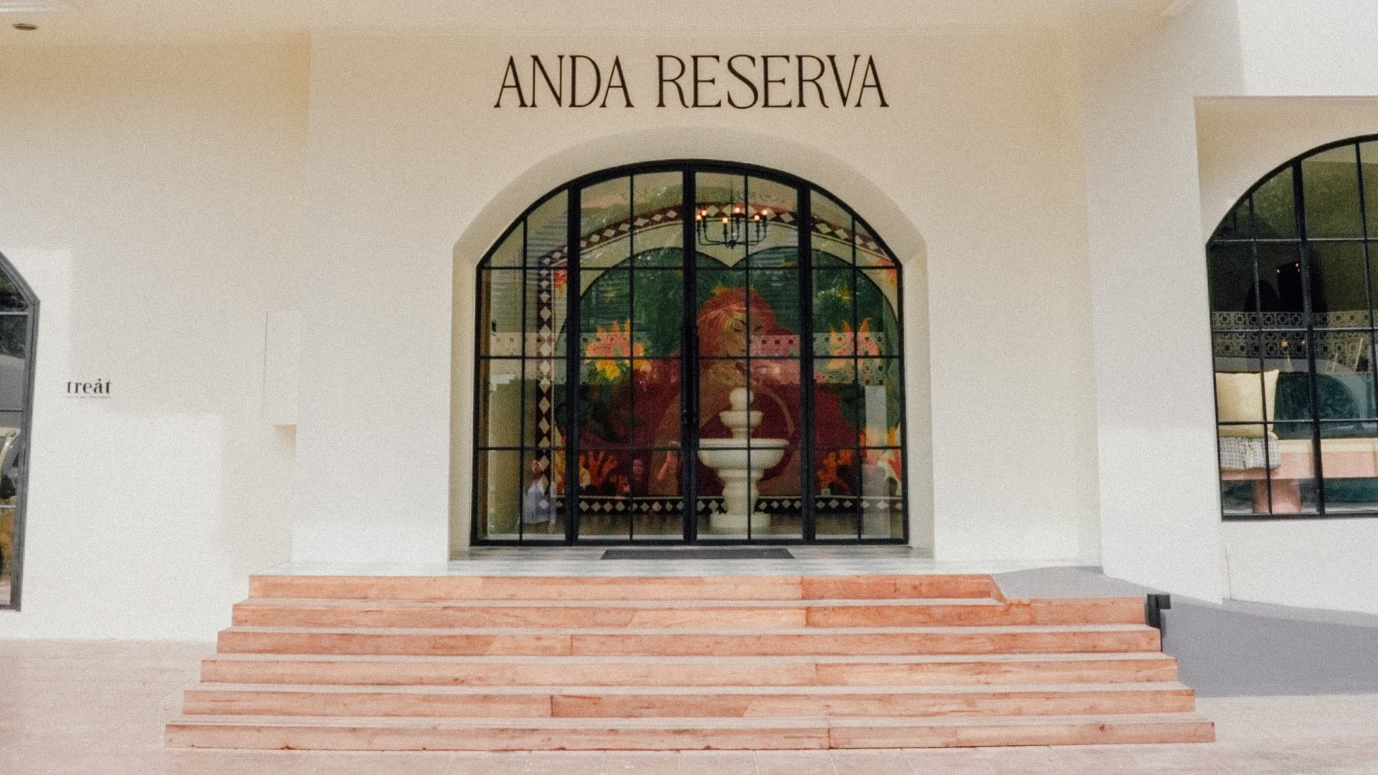 Interior of Anda Reserva social wellness club with warm, calming tones